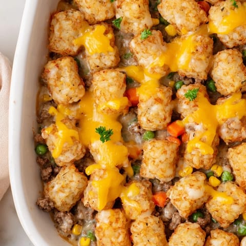 The hearty Tater Tot Casserole is baked until bubbling and served hot for a family weeknight dinner.