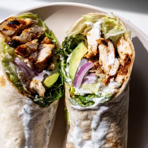 Smoky Chipotle Chicken Wrap filled with tender grilled chicken, crisp veggies, and tangy yogurt sauce.